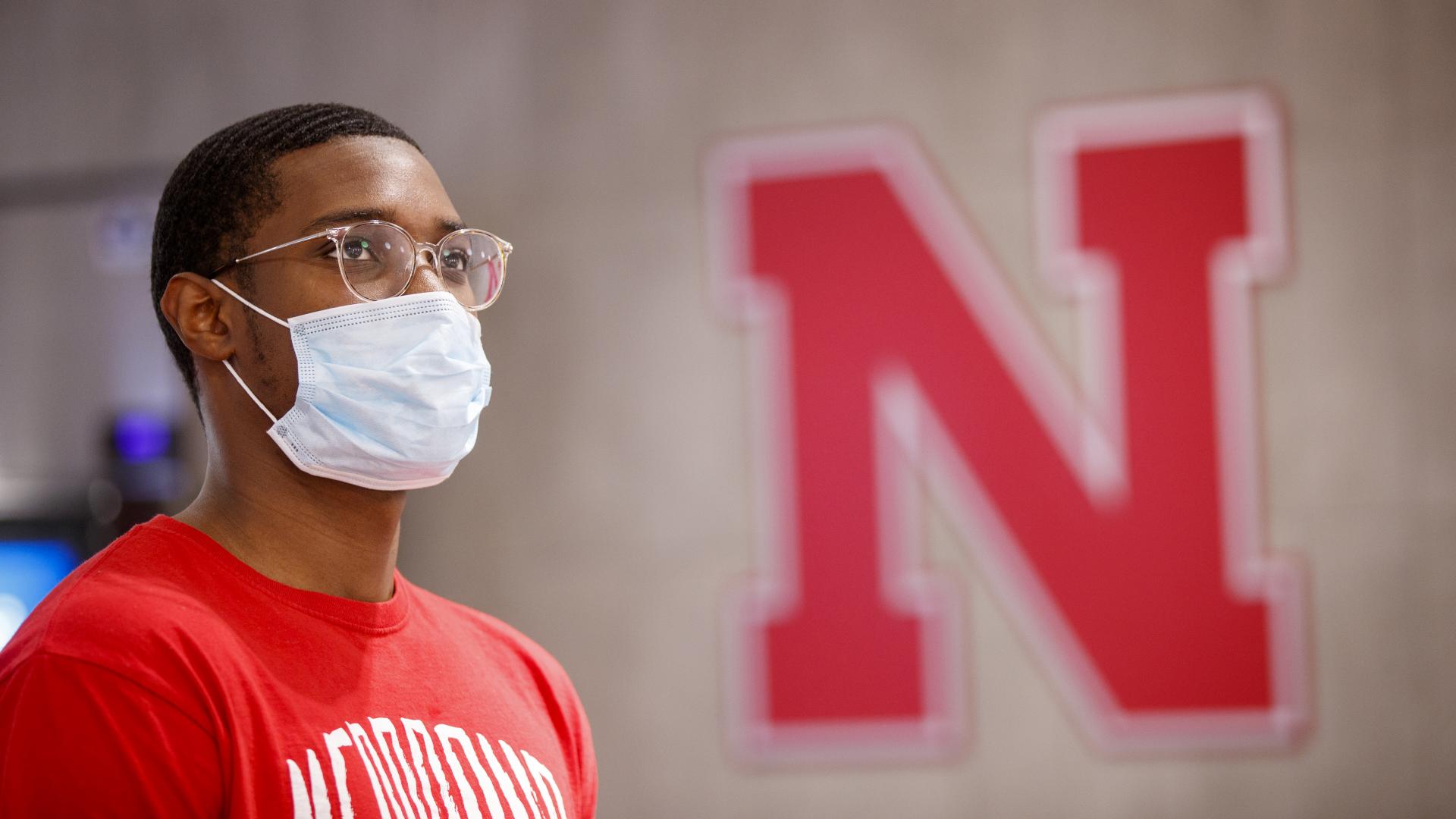 Husker student wears a face mask on campus in fall 2020. 